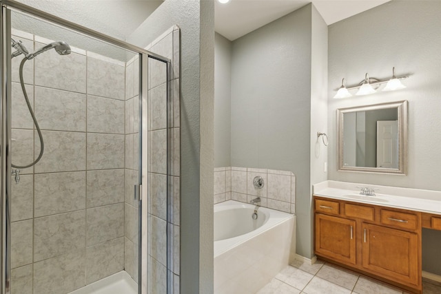 bathroom featuring tile patterned floors, vanity, and independent shower and bath