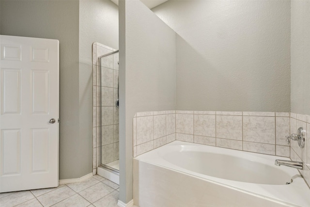 bathroom featuring shower with separate bathtub and tile patterned floors