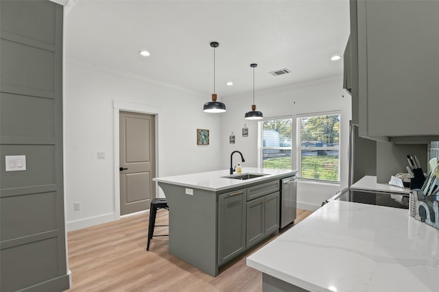 kitchen with sink, gray cabinets, ornamental molding, a center island with sink, and decorative light fixtures