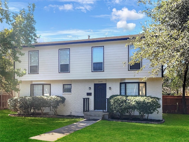 view of front of home with a front lawn