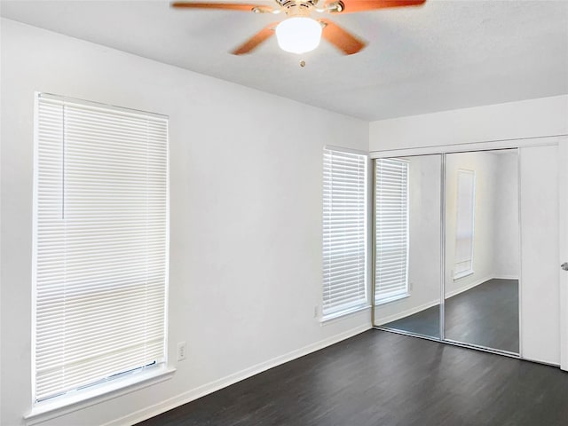 2649 Peavy Rd, Dallas, TX 75228 - unfurnished bedroom featuring dark wood-type flooring, a closet, and a ceiling fan