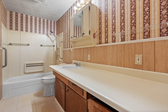 full bathroom featuring vanity, a textured ceiling,  shower combination, tile patterned flooring, and toilet