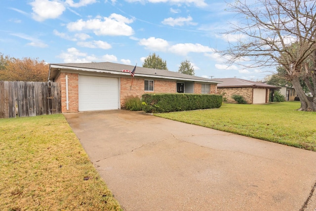 ranch-style house with a front yard and a garage