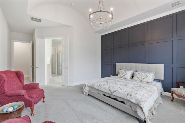 bedroom featuring lofted ceiling, a chandelier, and light carpet