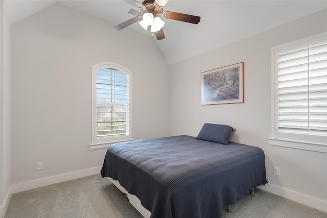 bedroom with lofted ceiling, light colored carpet, and ceiling fan