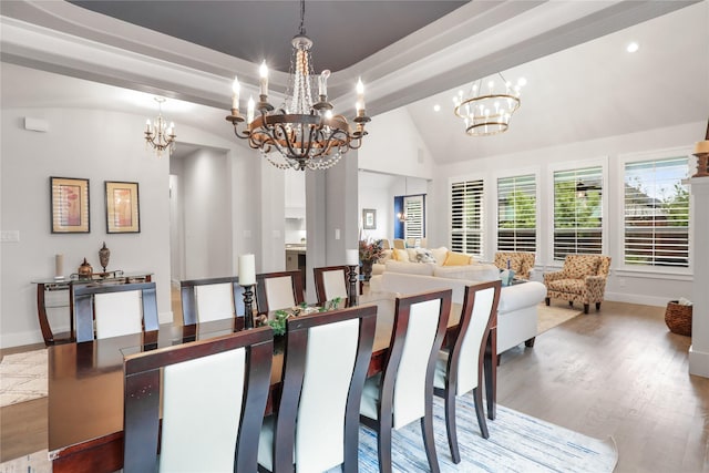 dining area with an inviting chandelier, beam ceiling, high vaulted ceiling, and hardwood / wood-style flooring