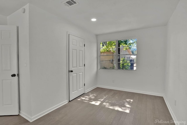 unfurnished bedroom featuring wood-type flooring