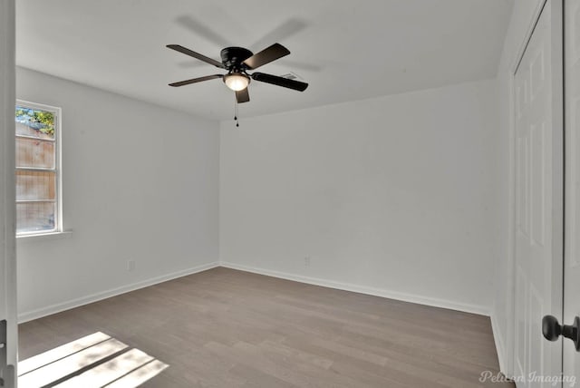 empty room featuring light hardwood / wood-style flooring and ceiling fan