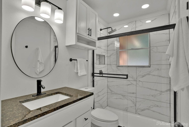 bathroom with vanity, an enclosed shower, and toilet