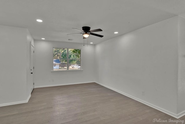 unfurnished room featuring ceiling fan and wood-type flooring