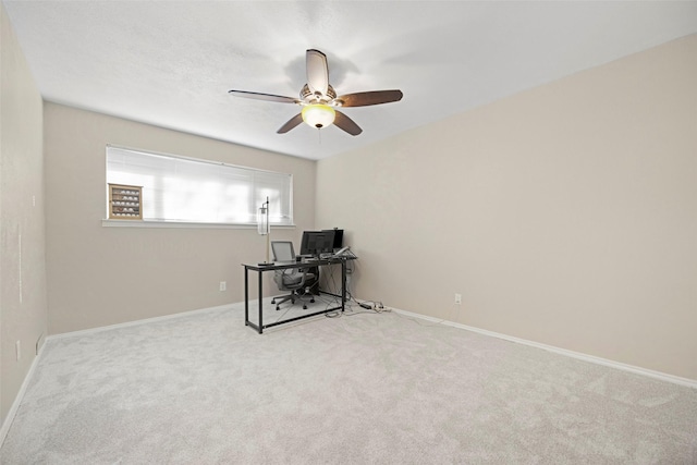 office with ceiling fan and light carpet