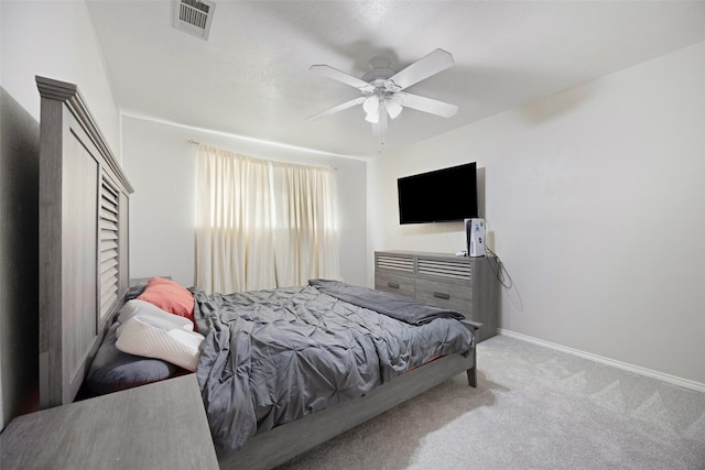 bedroom featuring ceiling fan and light carpet