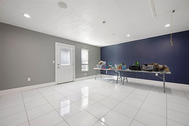 interior space with a textured ceiling