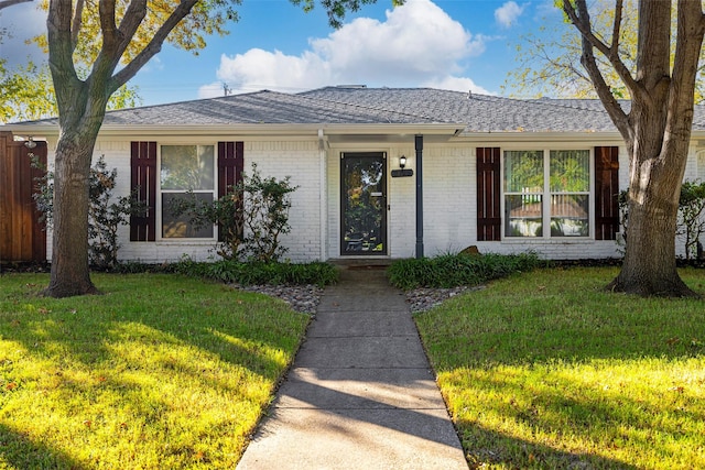 ranch-style house with a front yard