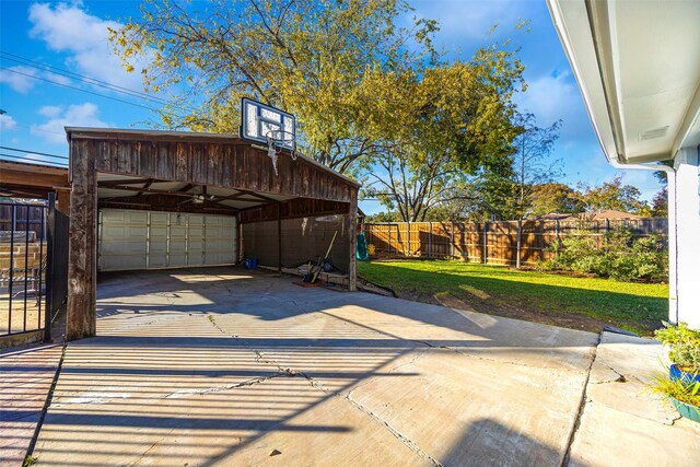 view of patio / terrace featuring a carport and a garage