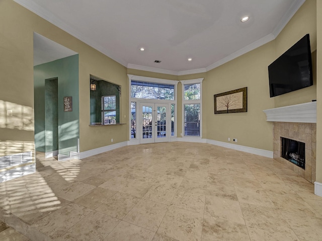 unfurnished living room featuring a fireplace, french doors, and ornamental molding