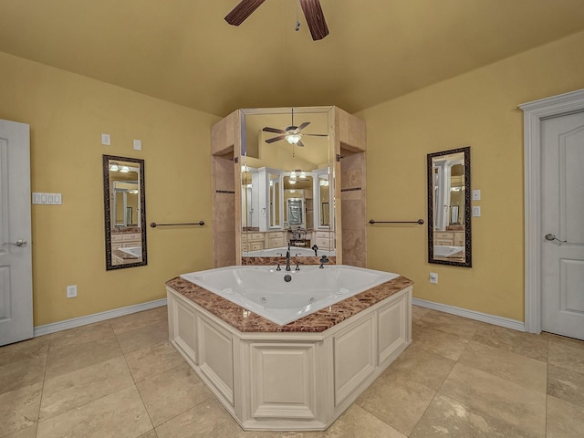 bathroom with tile patterned flooring, ceiling fan, lofted ceiling, and a bath