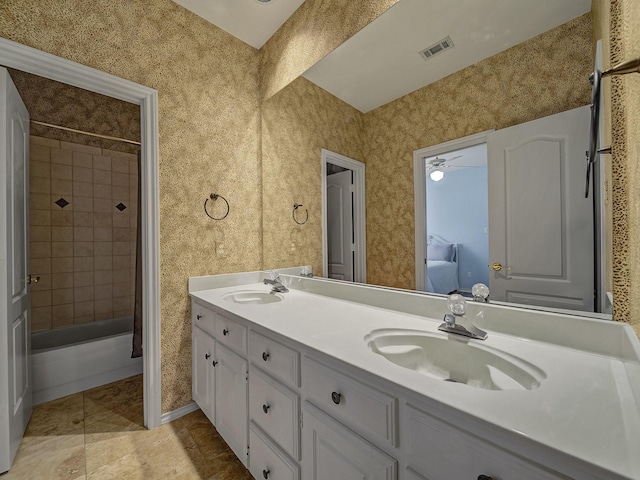 bathroom featuring shower / tub combo, vanity, tile patterned floors, and ceiling fan