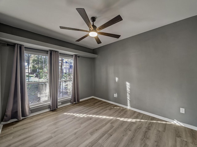 unfurnished room with light hardwood / wood-style flooring and ceiling fan