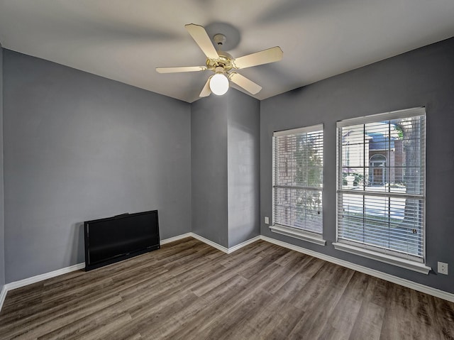 unfurnished room featuring ceiling fan and wood-type flooring