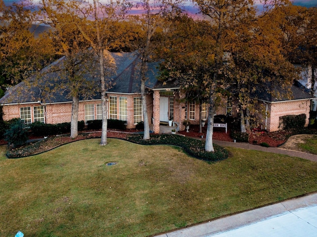 view of front of home with a yard