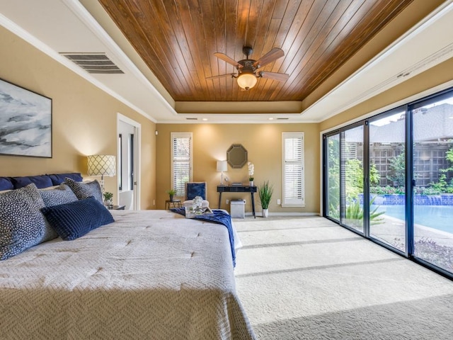 bedroom featuring carpet flooring, ceiling fan, access to exterior, a tray ceiling, and wood ceiling