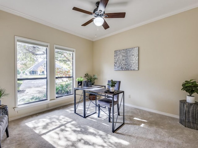 office area featuring light colored carpet, ceiling fan, and crown molding