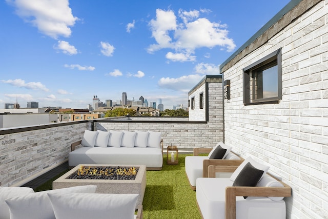 view of patio featuring an outdoor living space with a fire pit