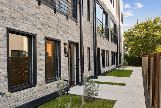 view of property exterior featuring a patio area