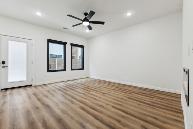 unfurnished room featuring ceiling fan and light hardwood / wood-style flooring