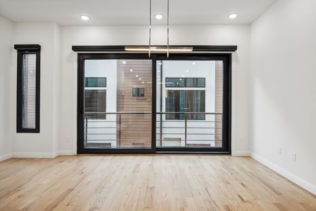 empty room featuring light hardwood / wood-style floors