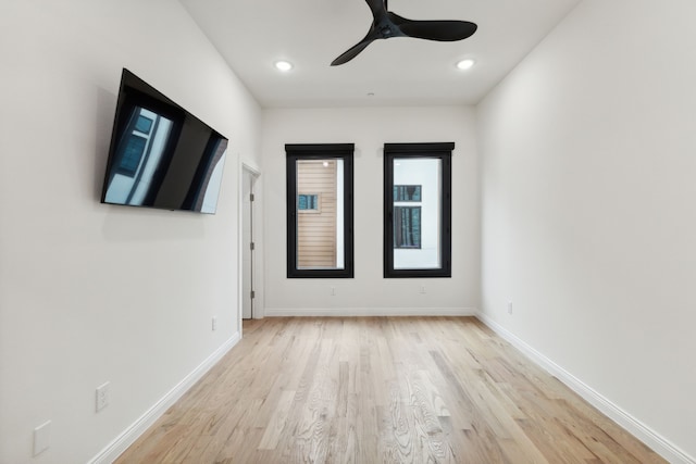 unfurnished room featuring ceiling fan and light hardwood / wood-style flooring