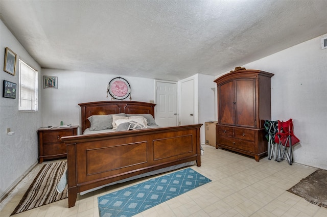 bedroom with a textured ceiling