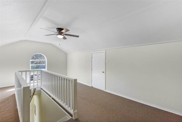 empty room with ceiling fan and light colored carpet