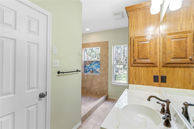 bathroom with vanity, tile patterned floors, and walk in shower