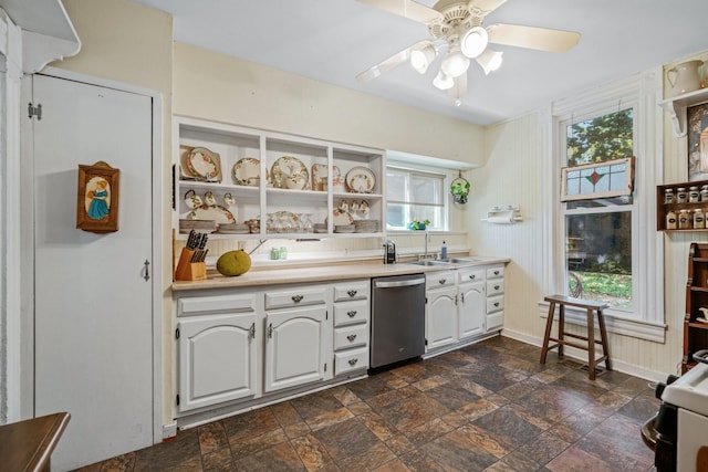 kitchen with white cabinetry, dishwasher, ceiling fan, and sink