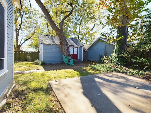 view of yard with a patio area and a shed