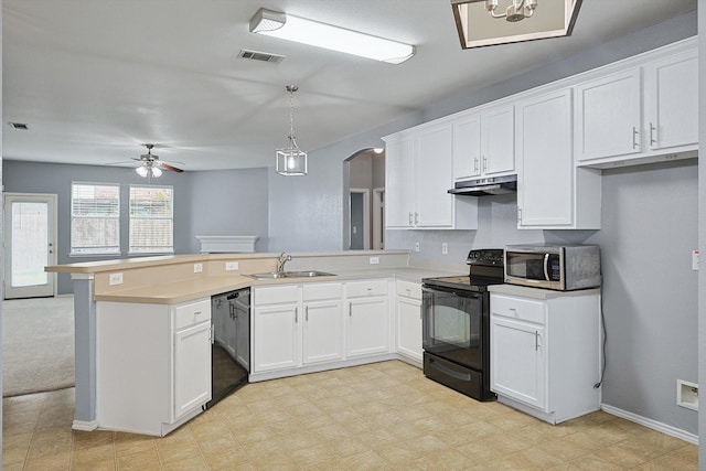 kitchen with ceiling fan, sink, black appliances, pendant lighting, and white cabinetry