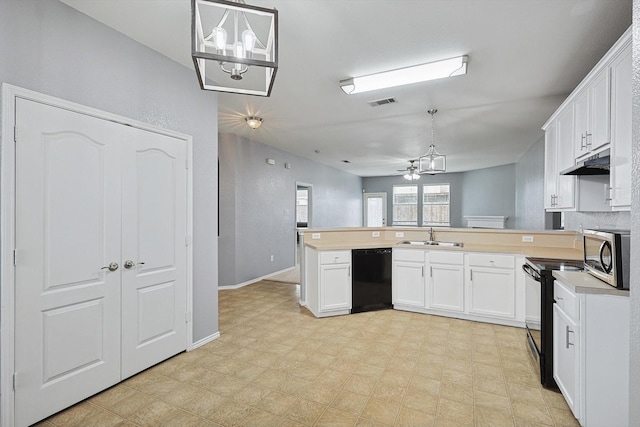 kitchen with white cabinetry, sink, kitchen peninsula, decorative light fixtures, and black appliances