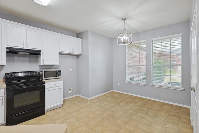 kitchen with white cabinets, black range with electric stovetop, hanging light fixtures, and a notable chandelier