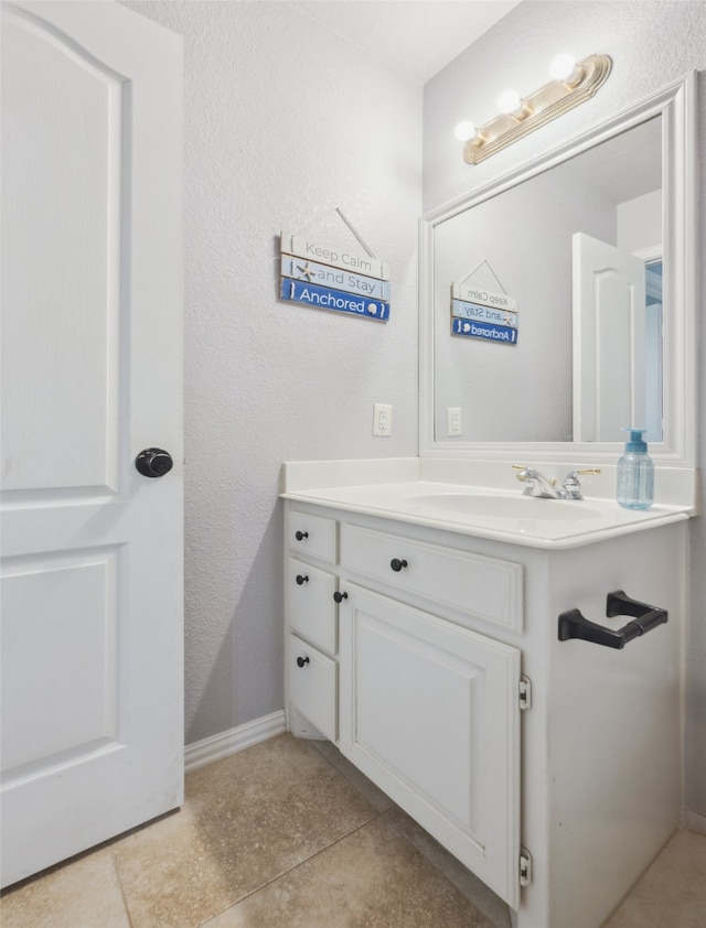 bathroom featuring tile patterned floors and vanity