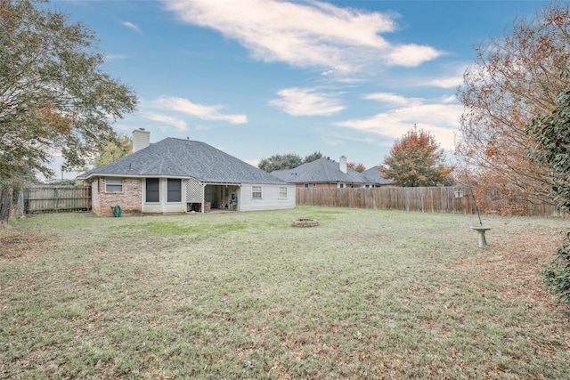 view of yard with an outdoor fire pit