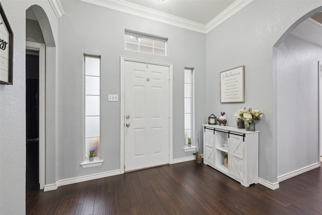 entryway with crown molding and dark hardwood / wood-style floors