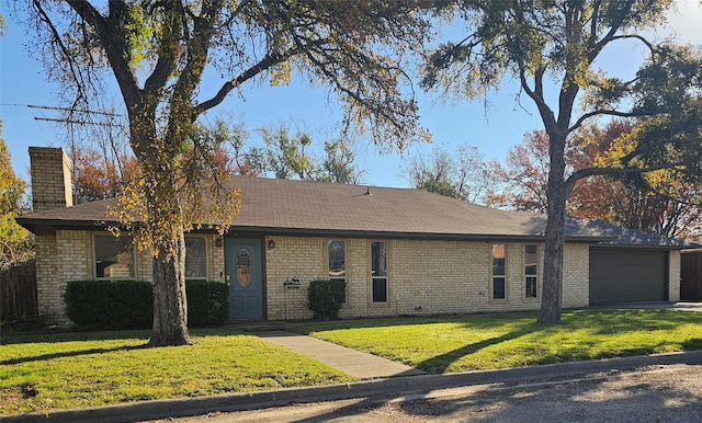 single story home featuring a garage and a front yard