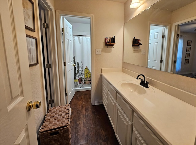 bathroom featuring hardwood / wood-style floors and vanity