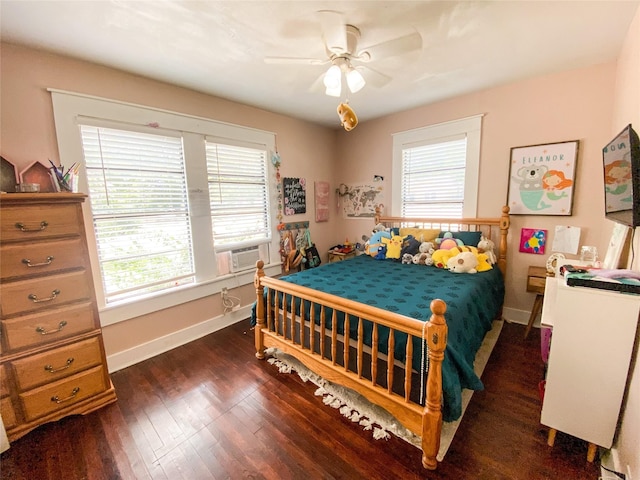 bedroom with dark hardwood / wood-style floors and ceiling fan