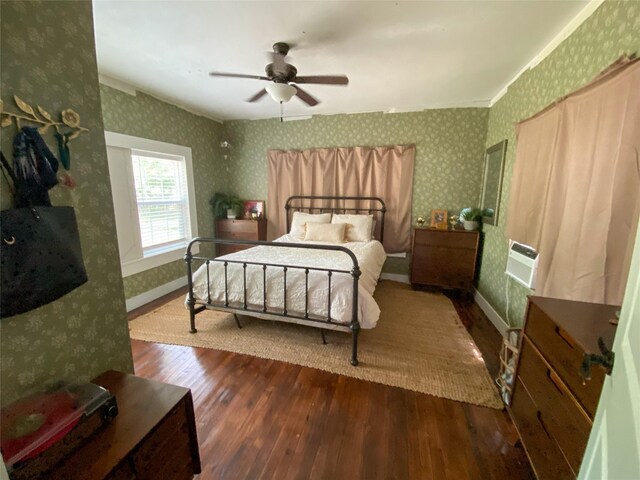 bedroom featuring ceiling fan, dark hardwood / wood-style flooring, and ornamental molding