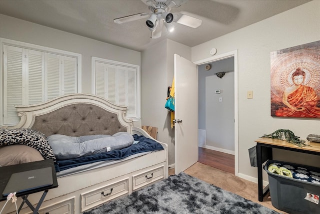 carpeted bedroom featuring ceiling fan