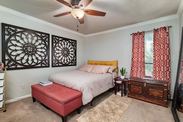 carpeted bedroom featuring ornamental molding and ceiling fan