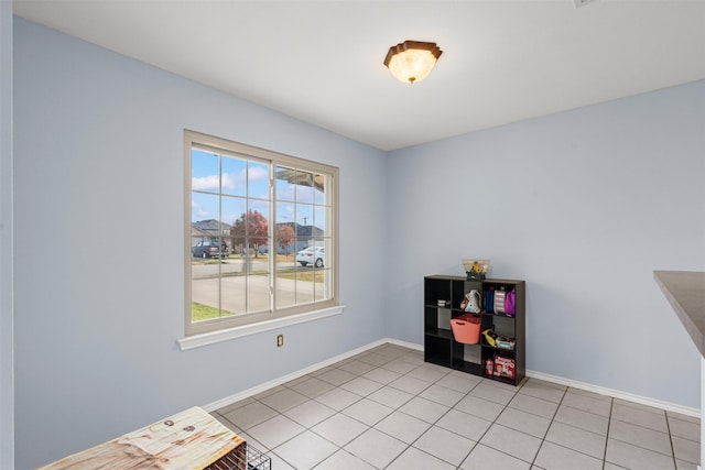 misc room with light tile patterned floors